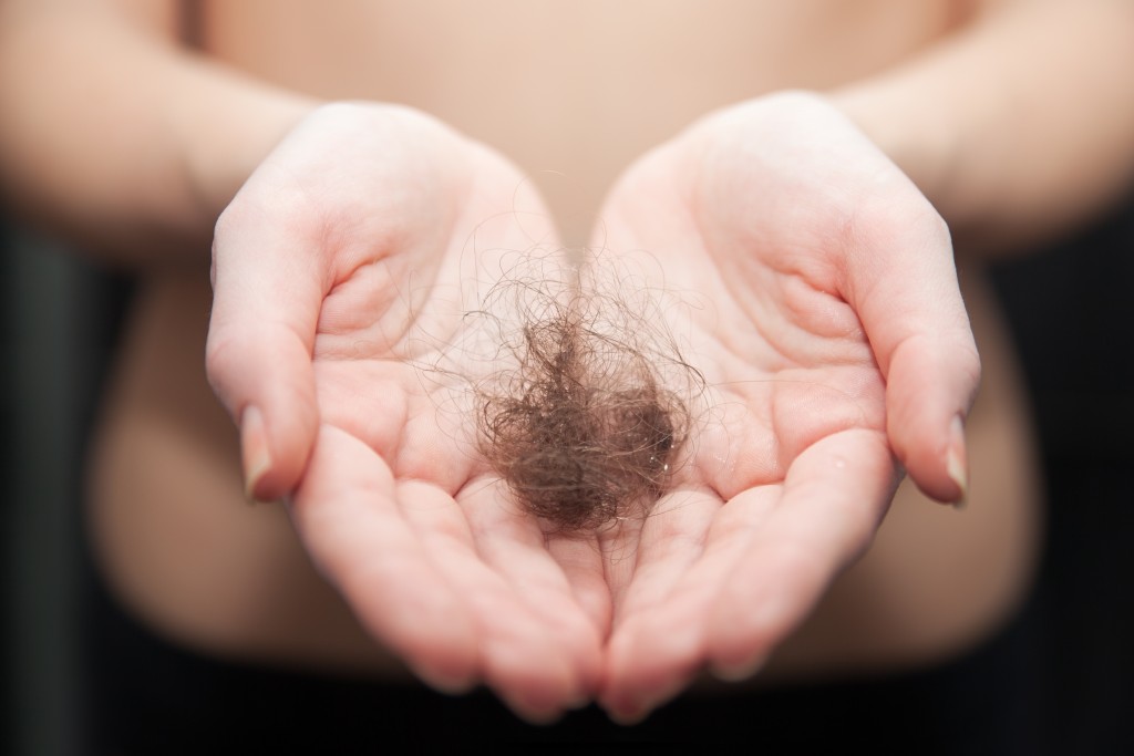 hands holding loss hair
