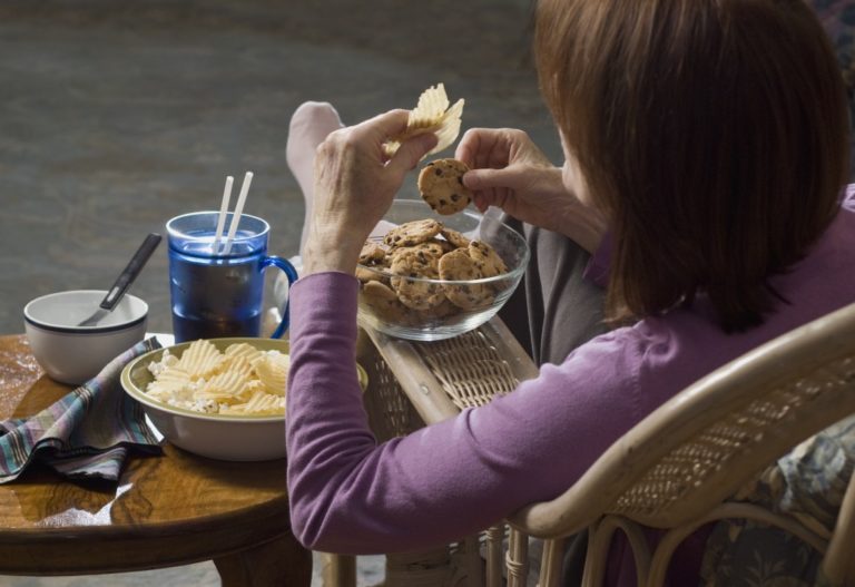 Woman eating junk food