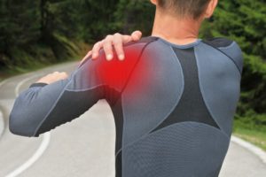 Man having a pain in his shoulder