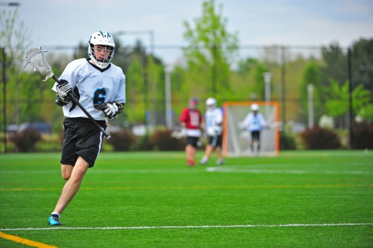 Lacrosse athlete running