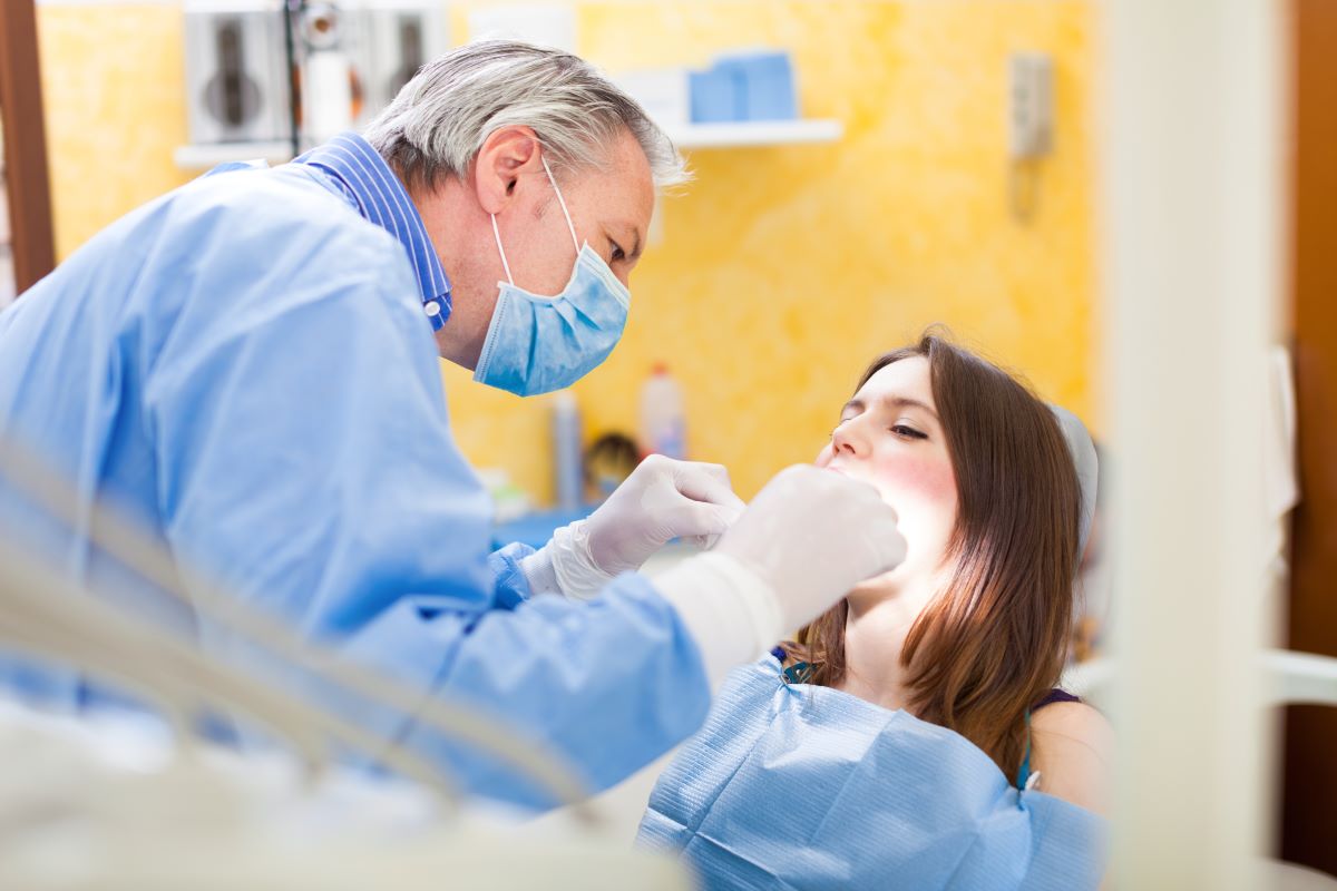 dentist attending to patient