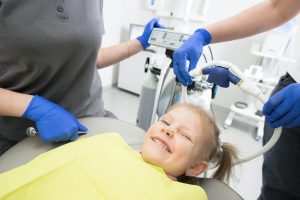 child visiting dentist regularly