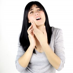 Woman with oral pain