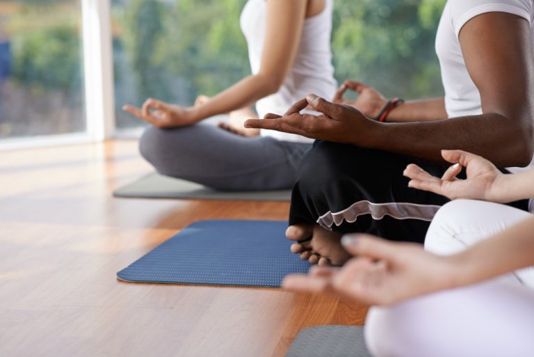 peopled meditating in lotus position