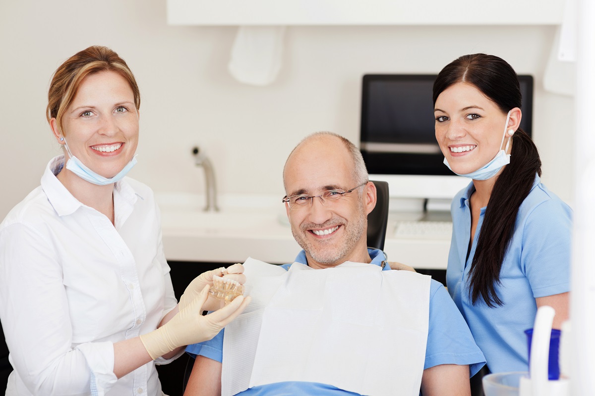 old man visiting a dentist