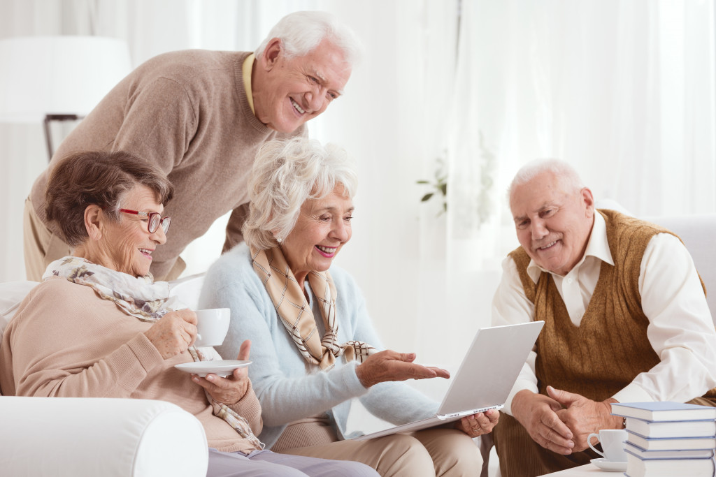 A group of seniors using a computer